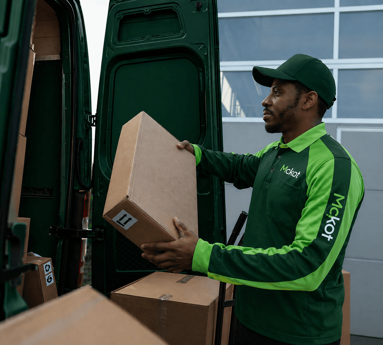 Mckot courier loading parcels for delivery